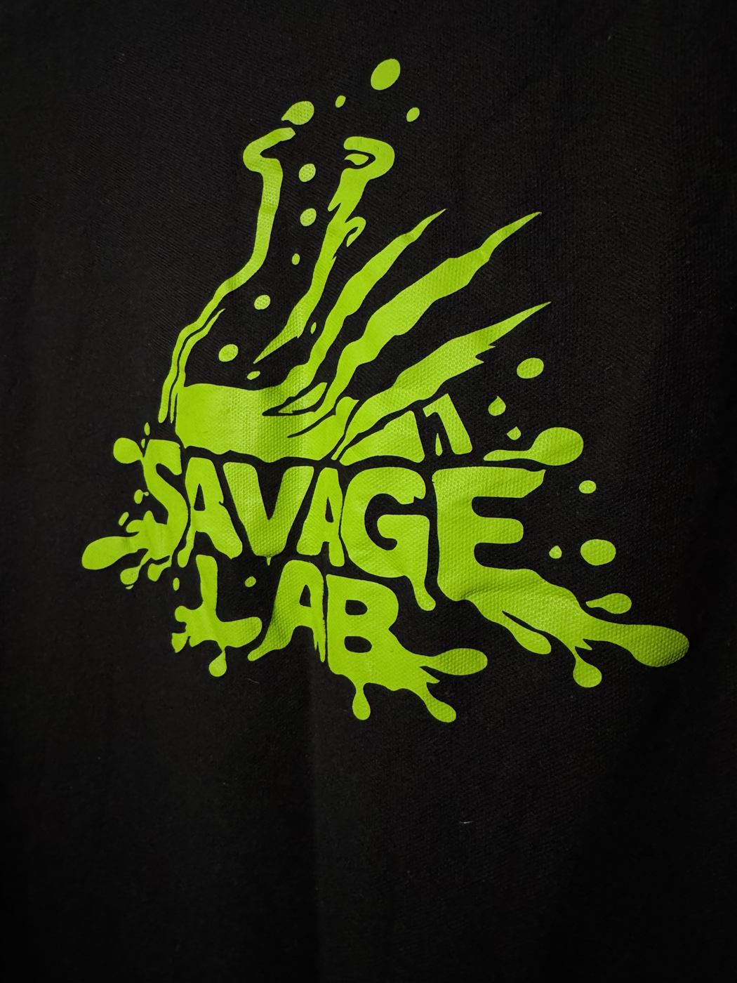 Close-up of a printed logo on a black garment