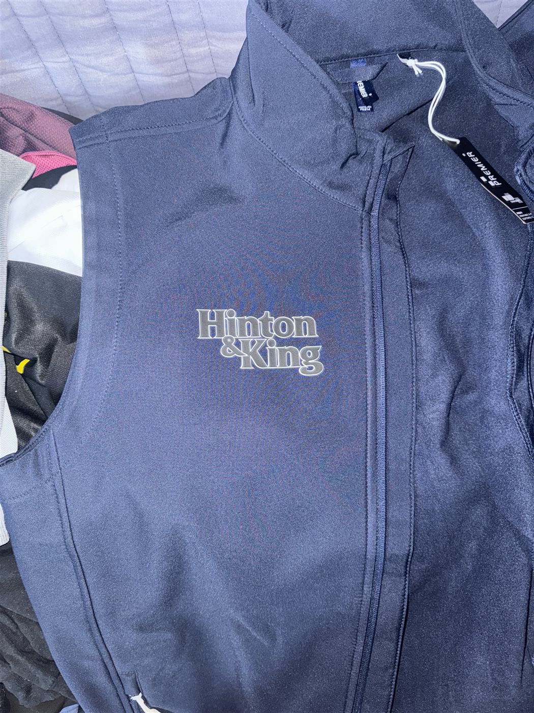 Printed workwear logo on a navy softshell gilet